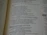 Close-up of an open book with elegant serif typography on creamy pages.