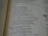 Close-up of an open book with elegant serif typography on creamy pages.