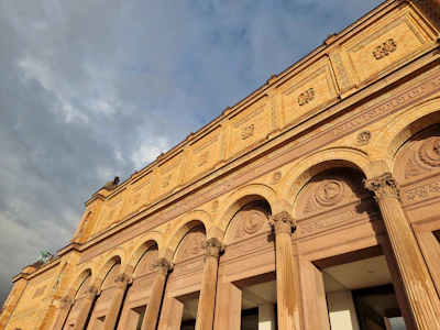 Government building exterior bathed in golden sunlight.