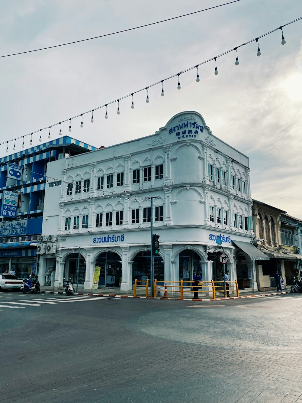 a large white building sitting on the corner of a street