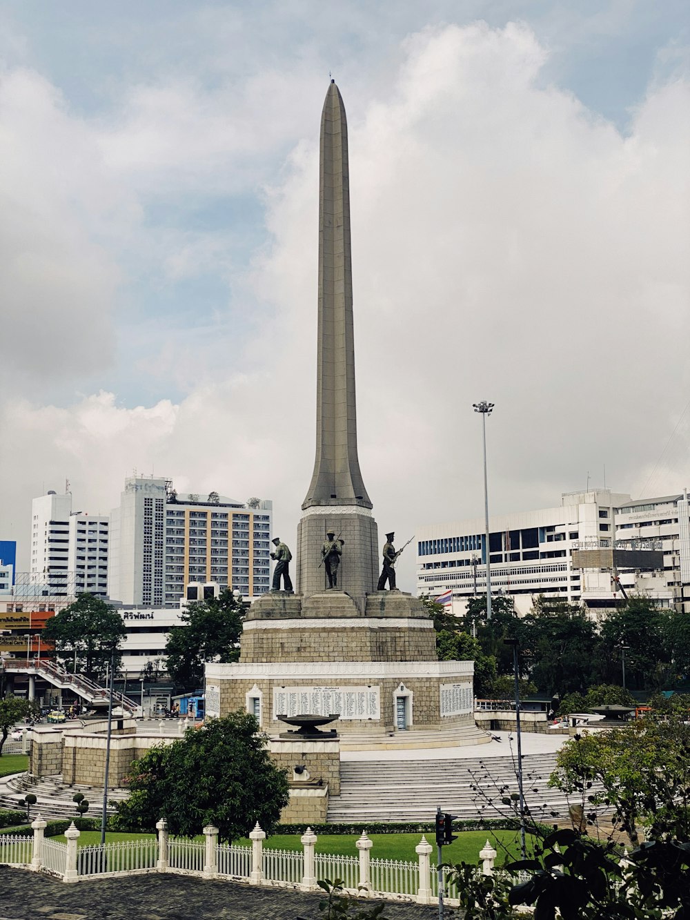 a tall monument with a statue on top of it