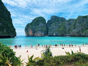 Tourists enjoying a scenic beach in Bali.