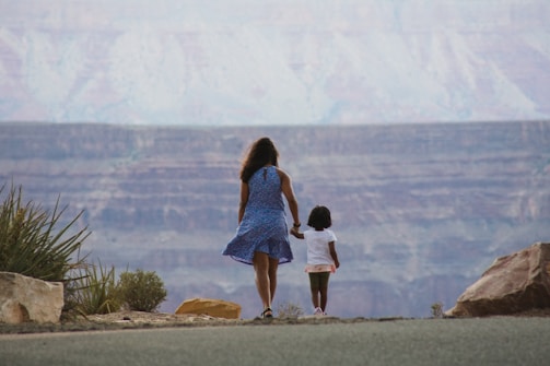 A friendly travel agent assisting a couple planning a trip to Mexico's Copper Canyon.