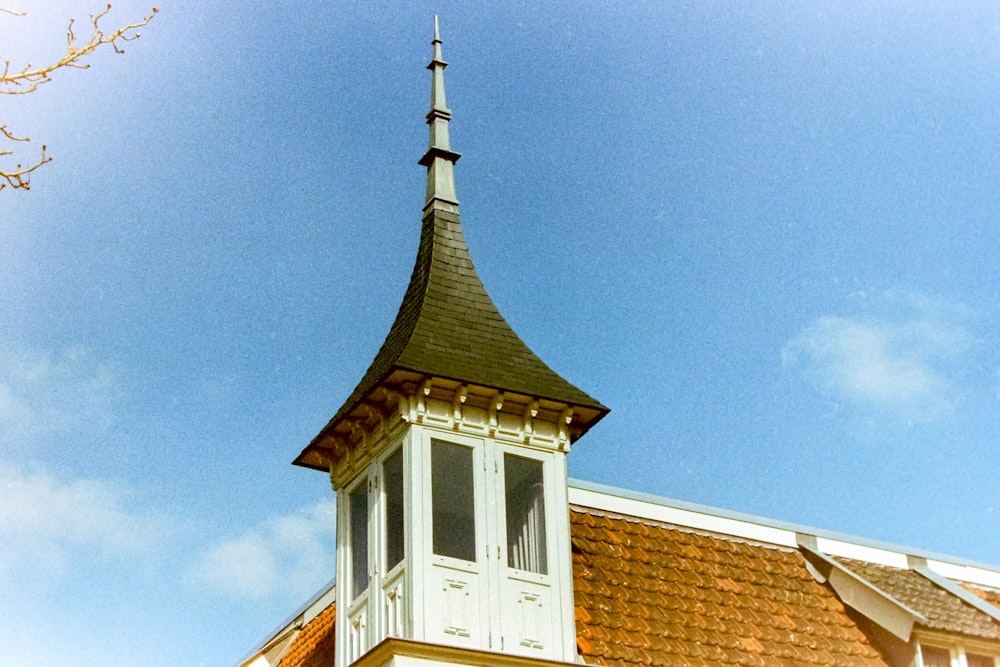 a church steeple with a clock on it