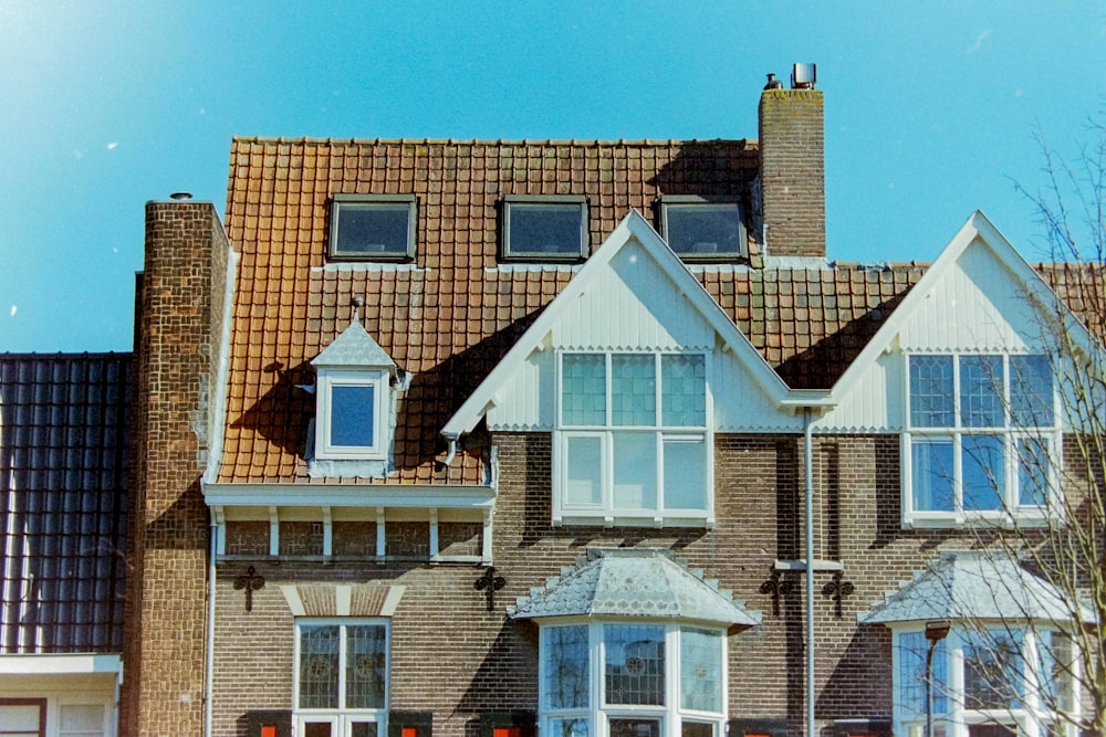 a large house with a clock on the front of it