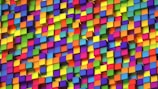 A vibrant array of multicolored 3D cubes stacked closely together in a random pattern. The cubes display a range of bright colors, creating a dynamic and lively visual effect.