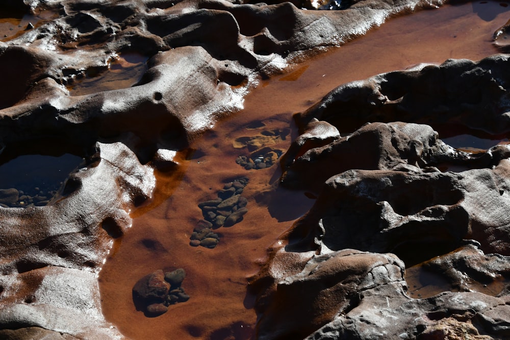 a stream of water running through a rocky area