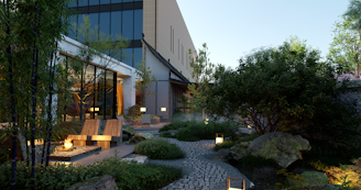 Преобразена градина с каменна тераса, дървета, цветни лехи и модерни мебели в дом на клиент Пловдив