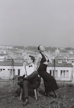 An elegant couple enjoying a quiet moment at a chic London rooftop venue.