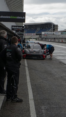 A group of drivers preparing for a service on a sunny day.