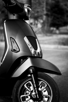 High-quality studio shot of a sleek Motu electric scooter with dramatic lighting.