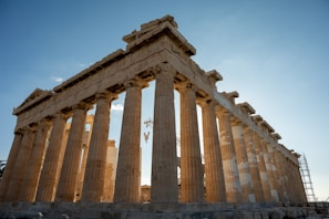Sunlight streaming through the columns of a partially restored temple in Asasif.