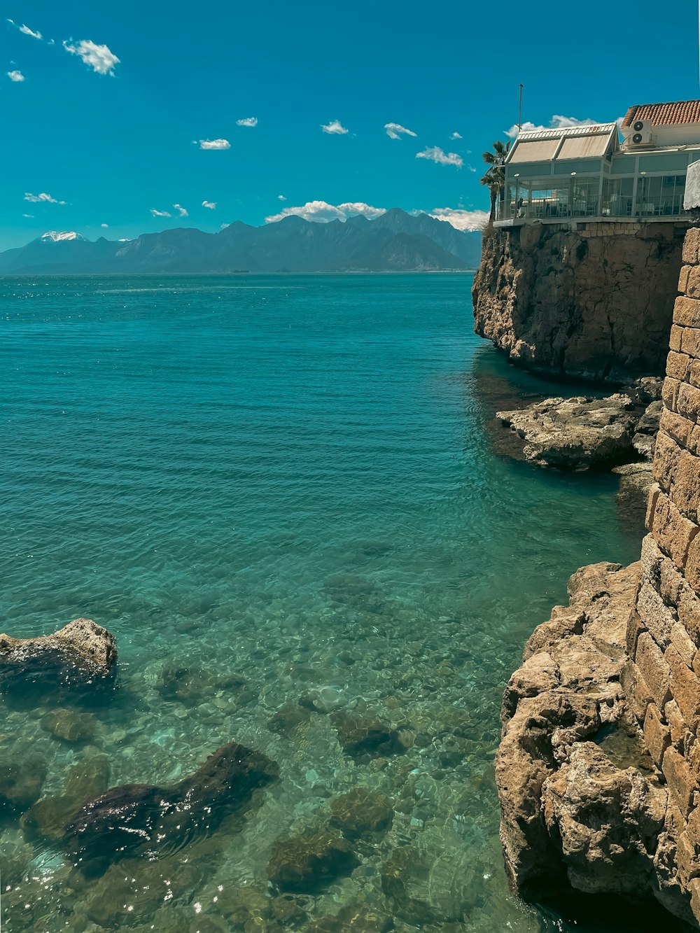 a view of the ocean from the shore of a beach