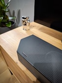 A stylish air purifier on a wooden table.