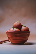 A warm, inviting photo of a handcrafted moong ladoo box with soft lighting.