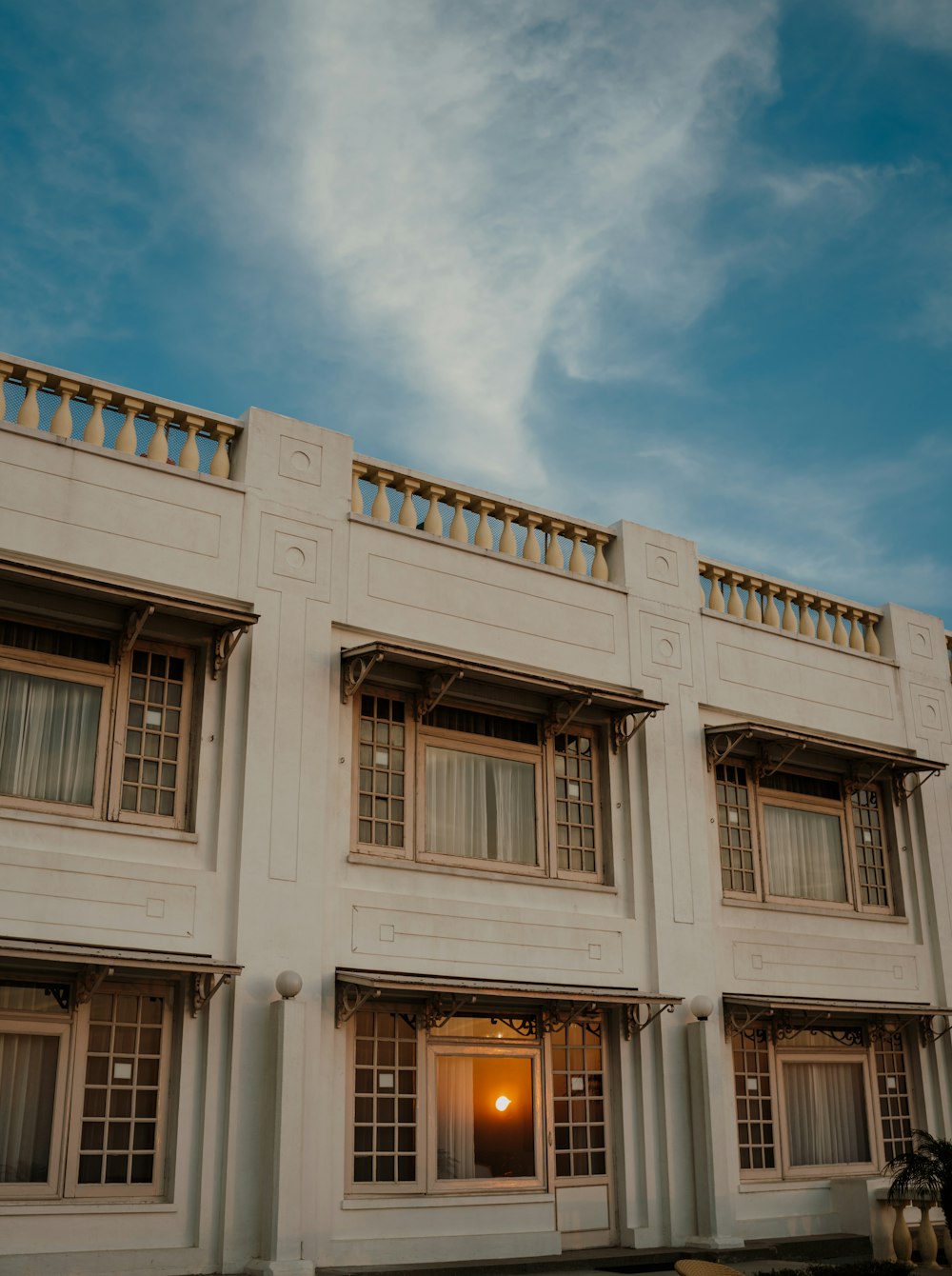 a large white building with windows and balconies