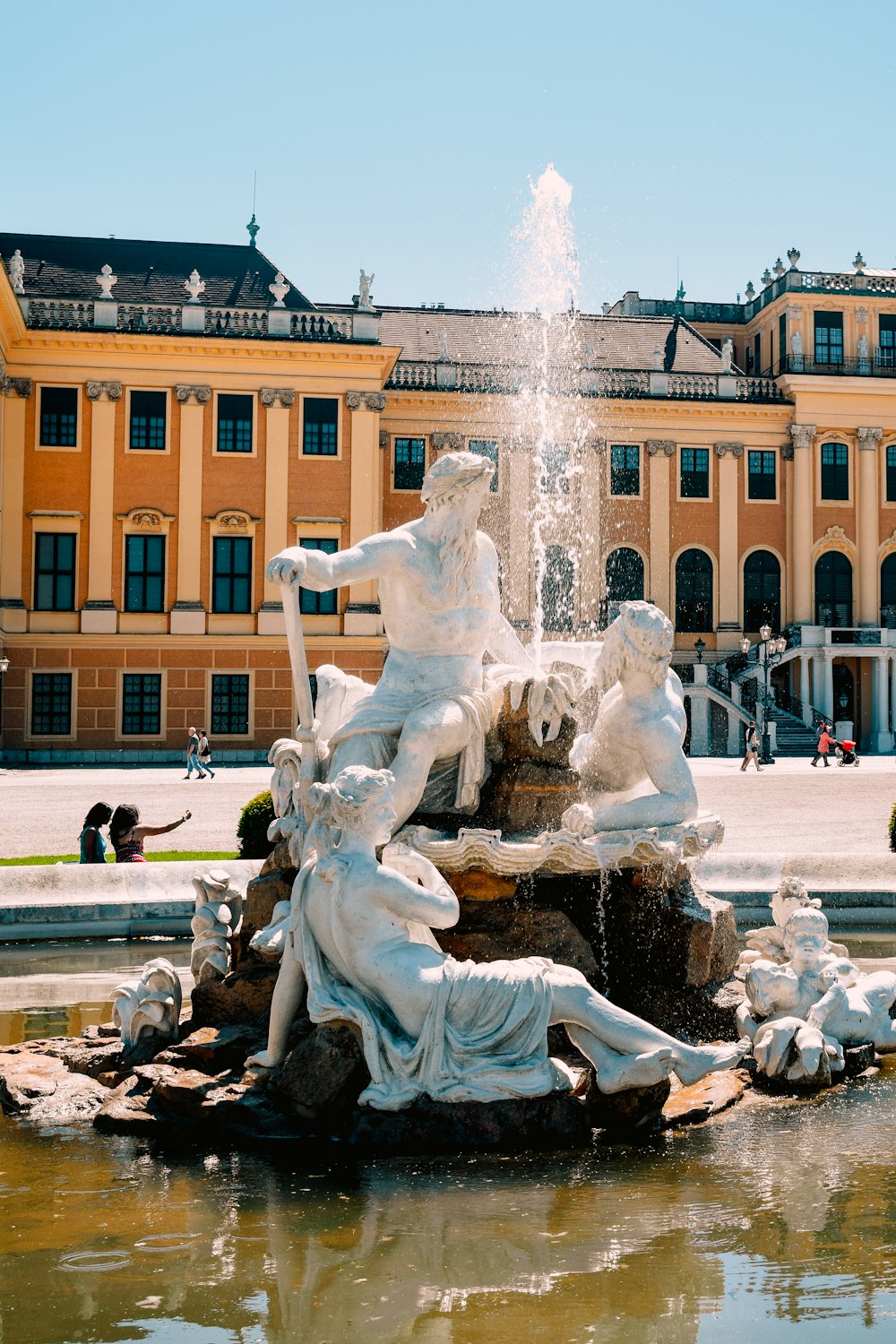 a fountain in front of a large building