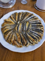 Boneless fish fillets arranged neatly on a plate.