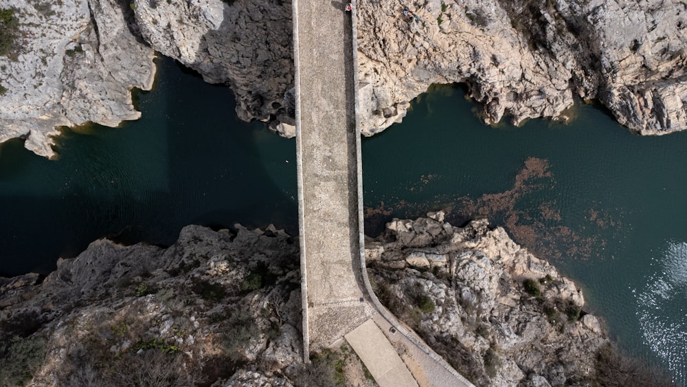 an aerial view of a bridge over a body of water