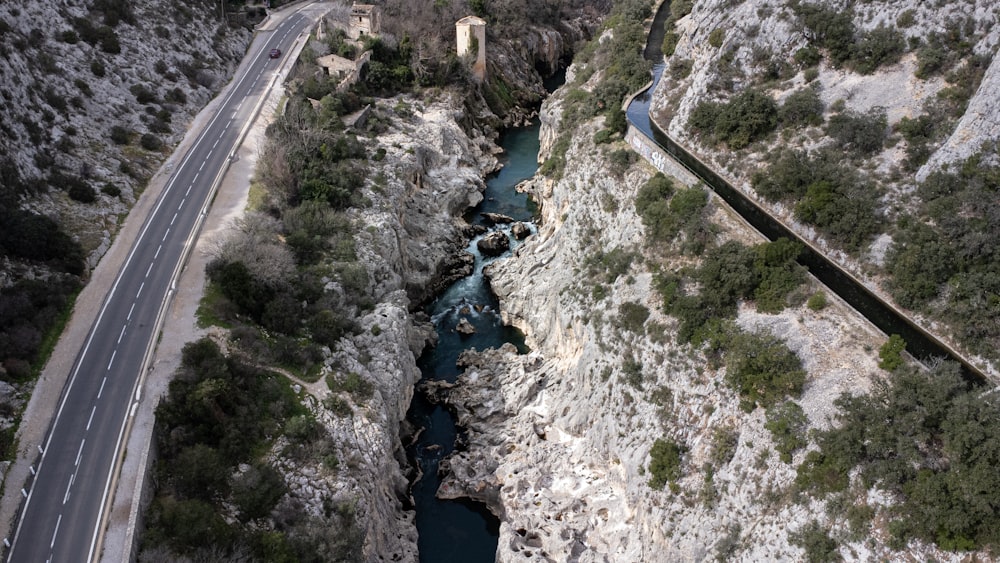 an aerial view of a road and a river