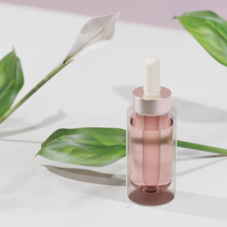 a pink bottle with a dropper sitting on a table next to a green plant