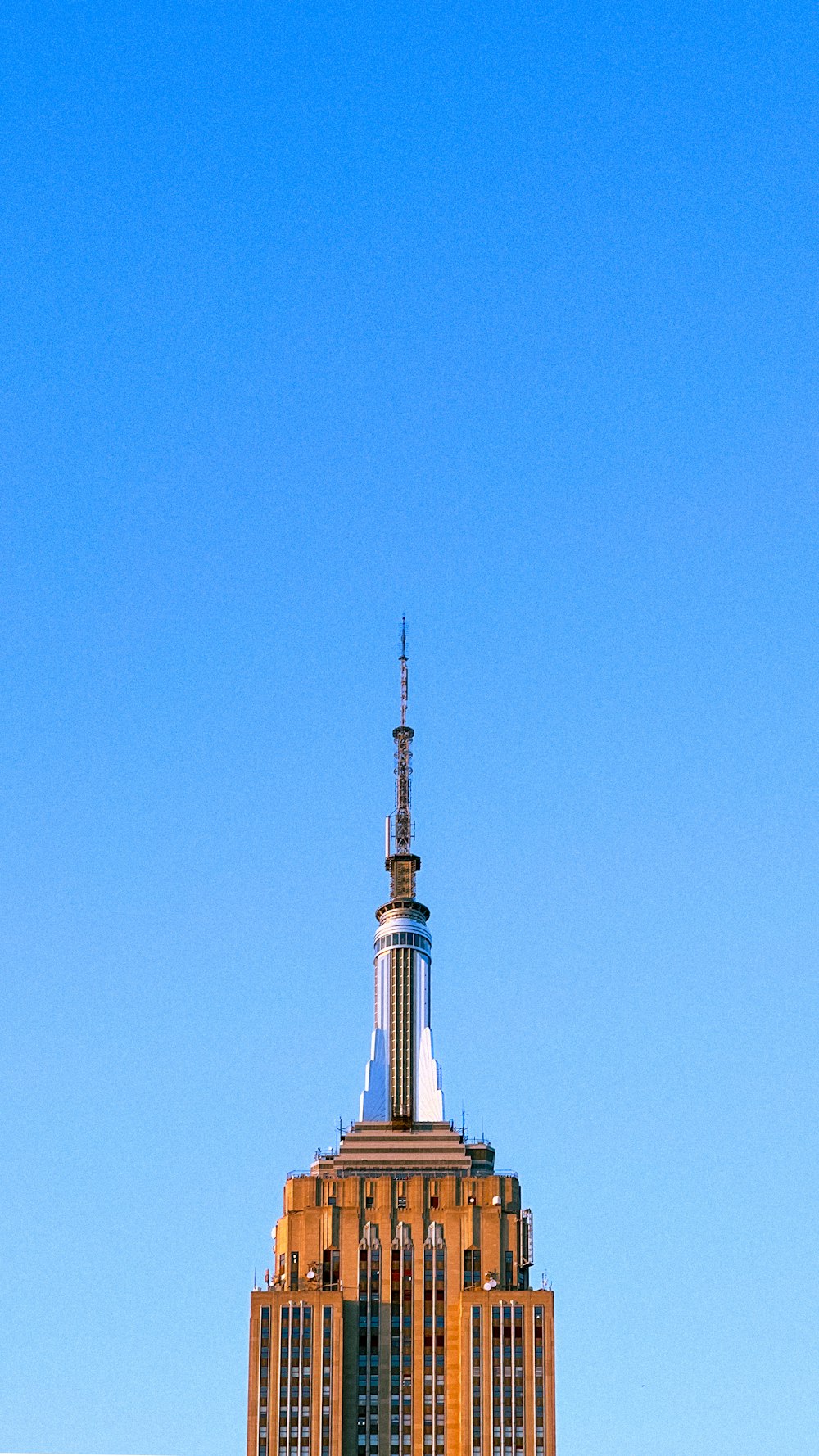 a very tall building with a clock on it's side