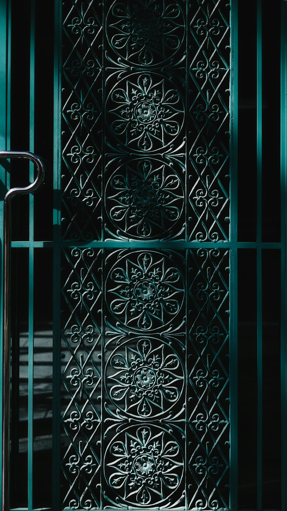 a close up of a metal door with a handle