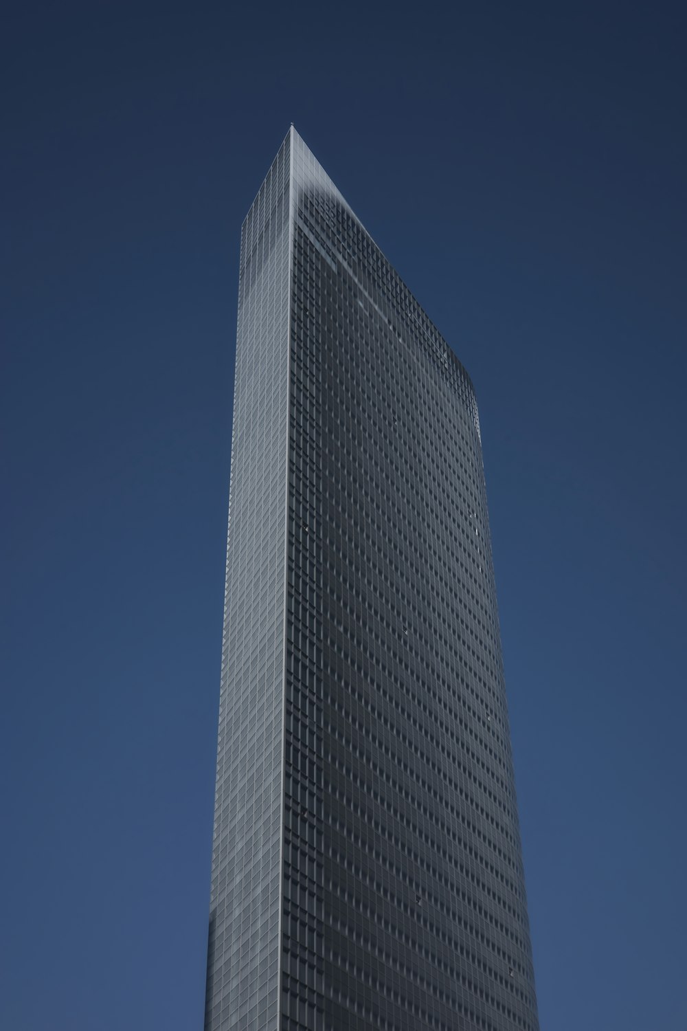 a very tall building with a sky background