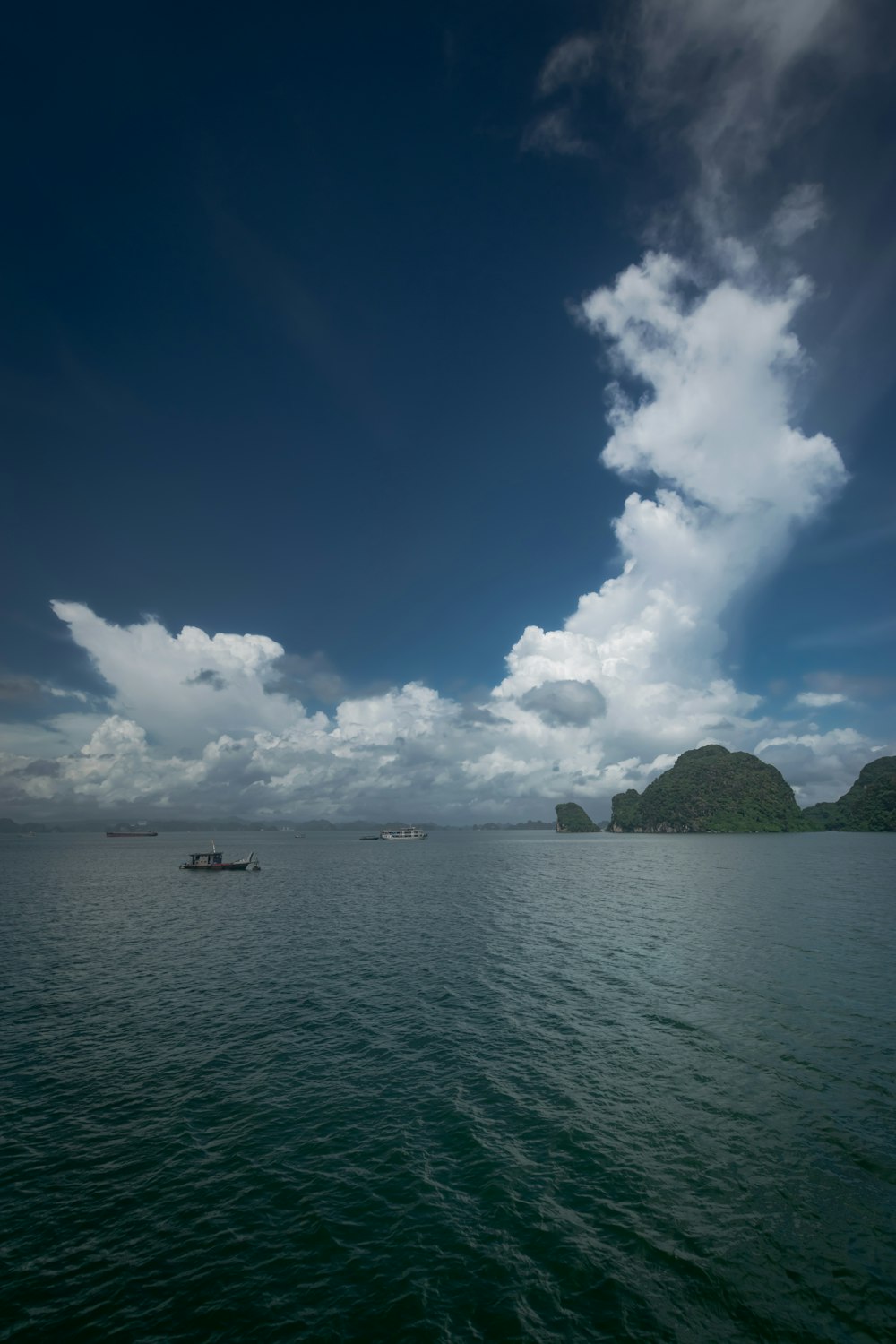 a boat floating on top of a large body of water