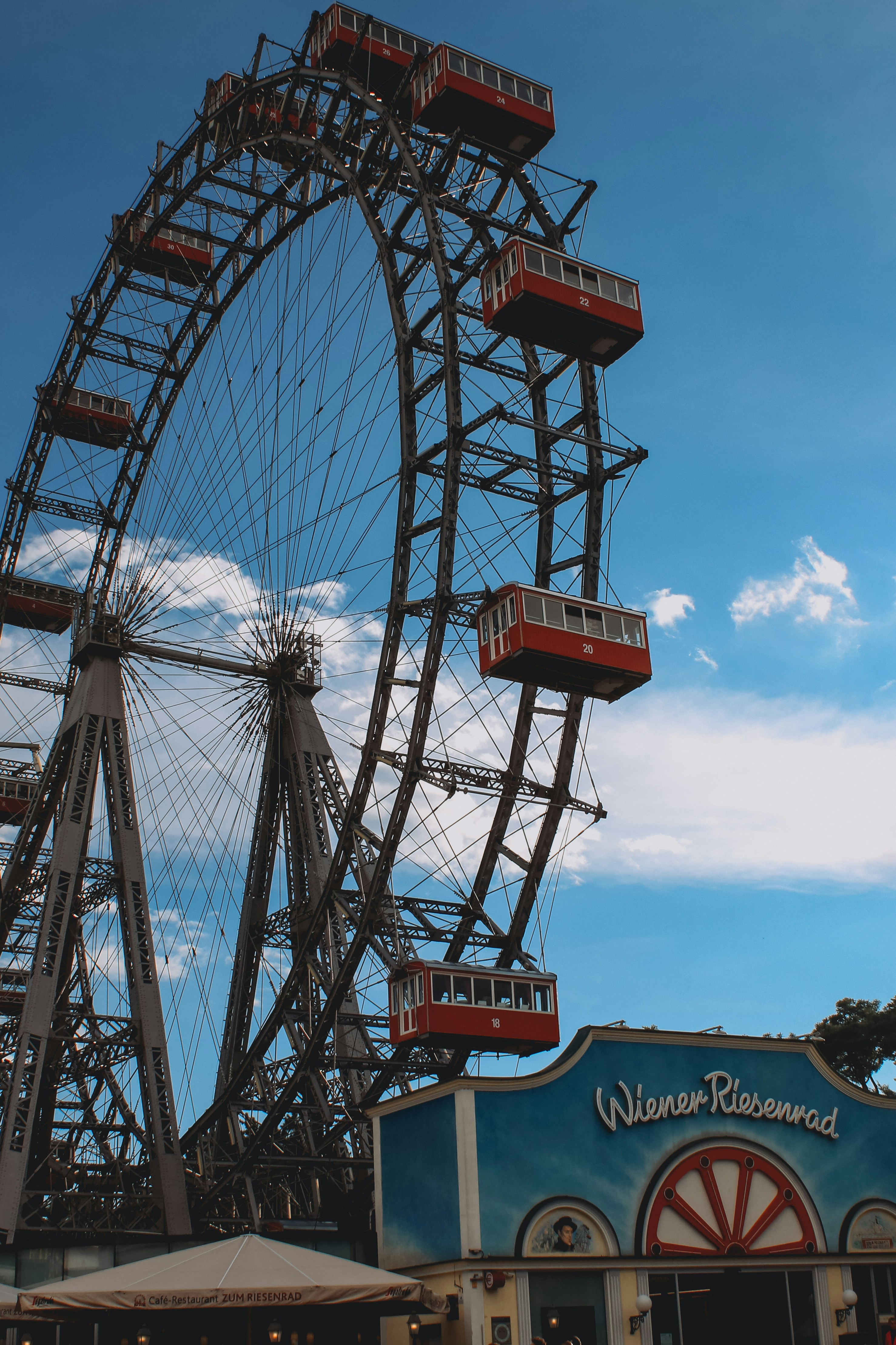 a large ferris wheel sitting next to a building