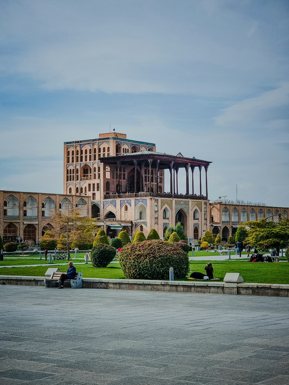 a large building sitting on top of a lush green field