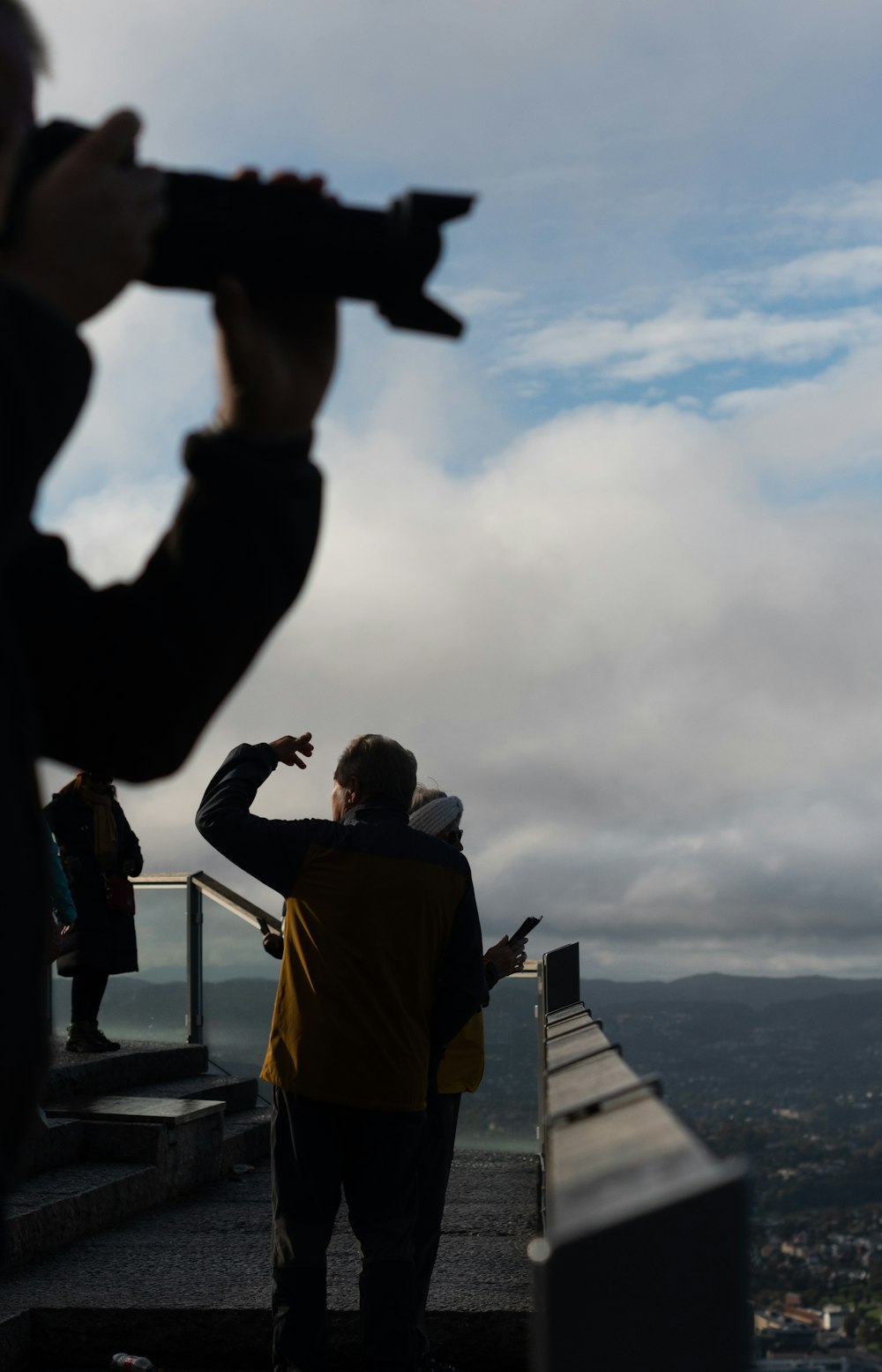 a man taking a picture of the sky with a camera