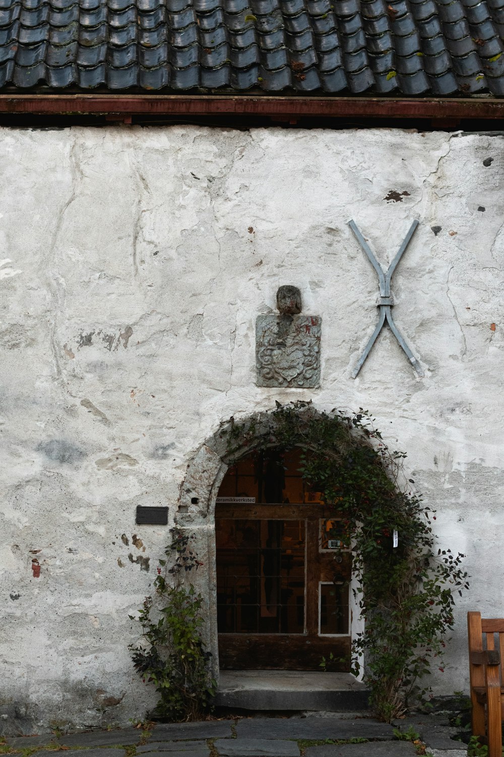 a white building with a statue of a man on it