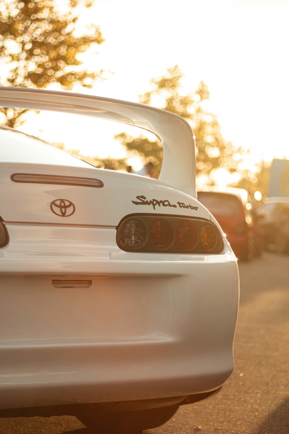 a white car parked on the side of the road