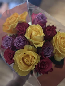 A vibrant bouquet of fresh flowers wrapped elegantly, ready for delivery.