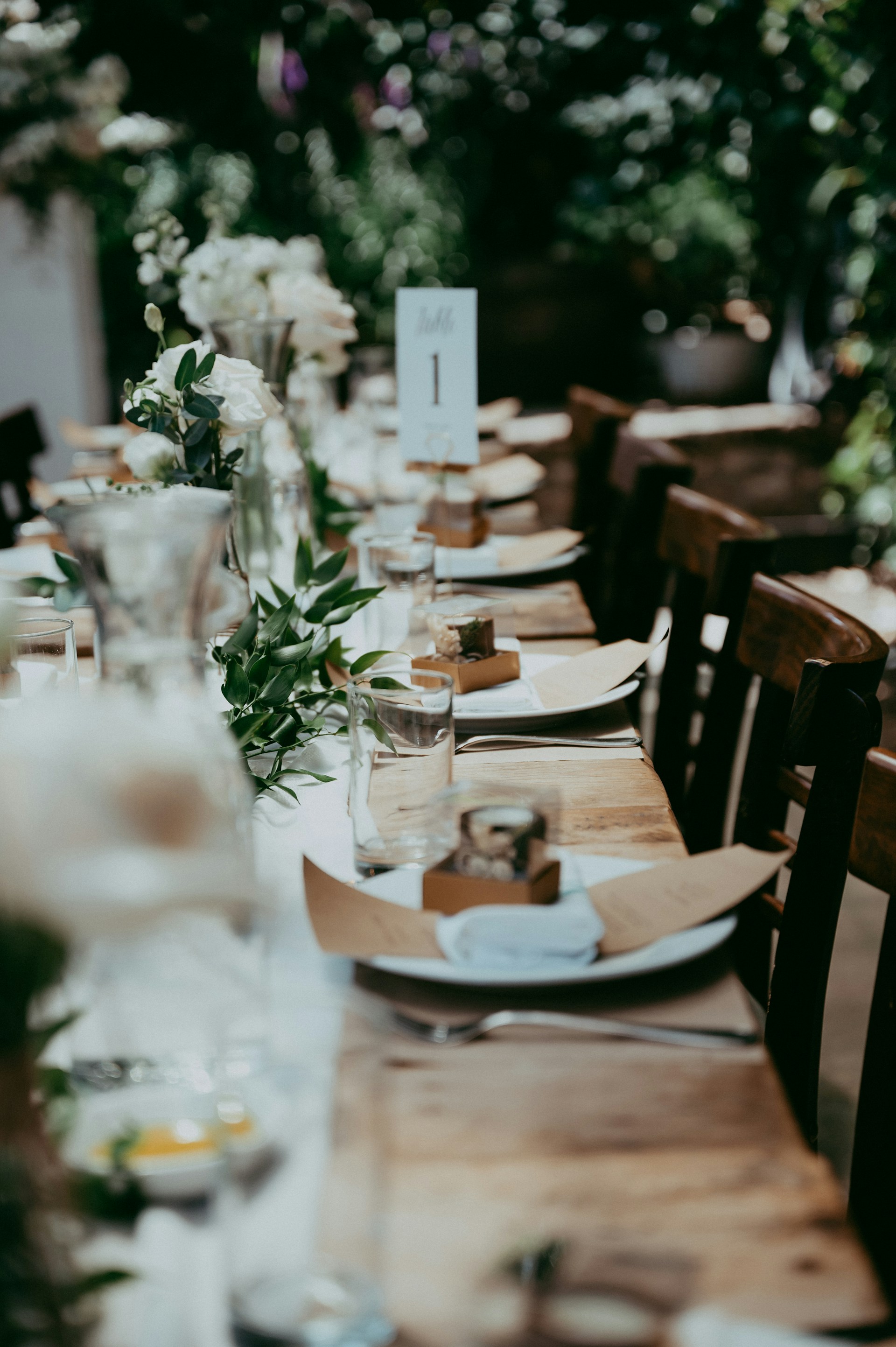a long table with plates and place settings