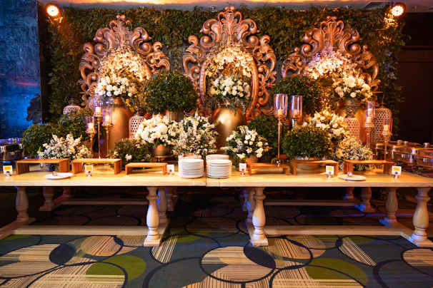 An elegant prasmanan buffet setup with warm lighting and neatly organized food trays.