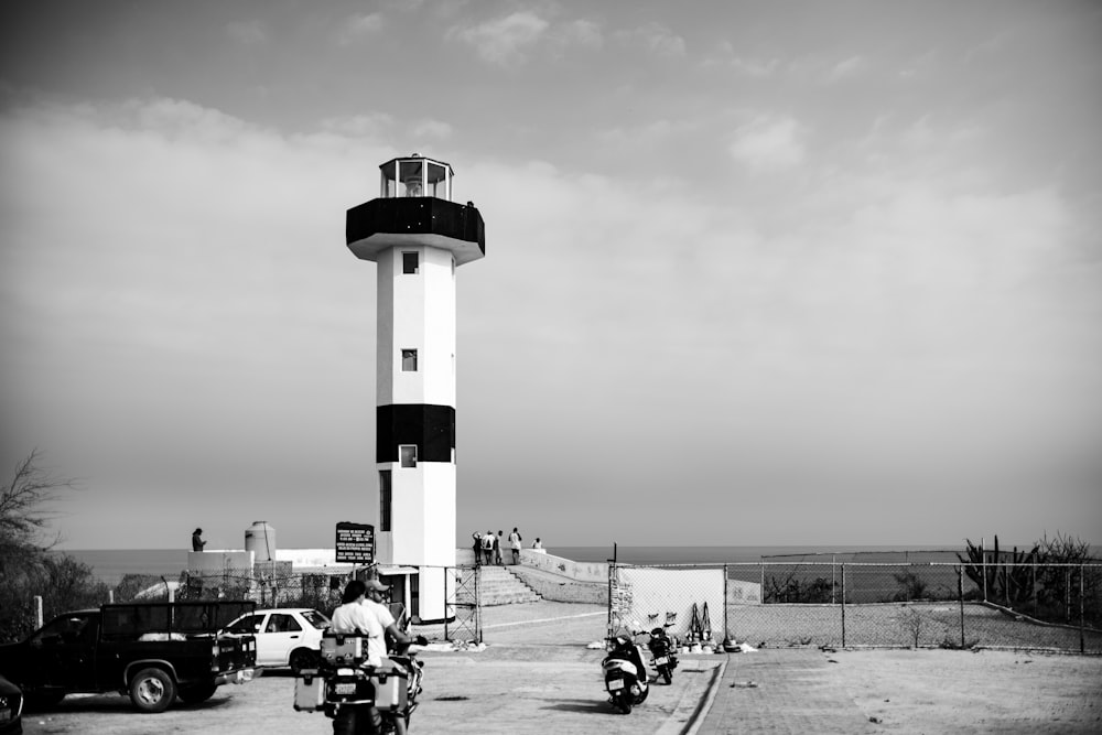 a black and white photo of a lighthouse