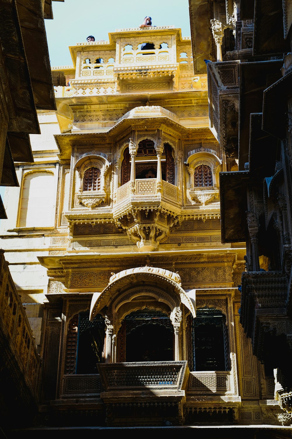 a building with a balcony and a staircase