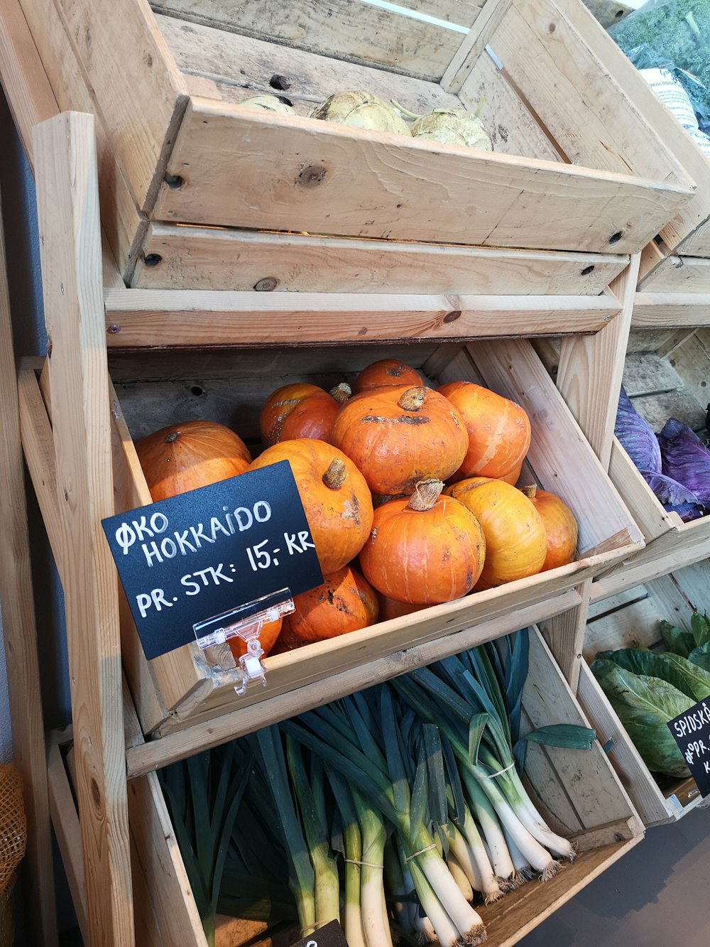 a display in a store filled with lots of vegetables