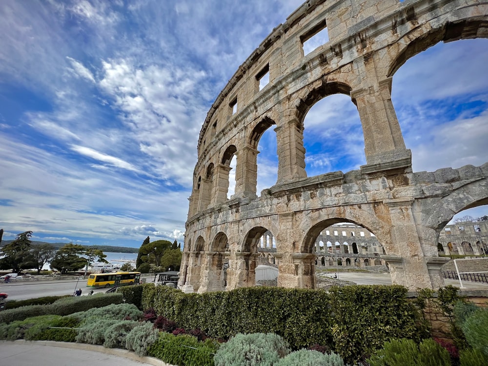 a large stone structure with arches and arches on top of it