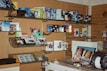 a room filled with lots of books and electronics