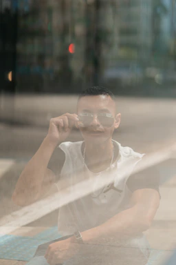 A friendly customer service representative wearing stylish sunglasses, ready to assist.