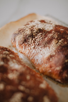 Close-up of freshly baked crusty bread on a rustic wooden table.