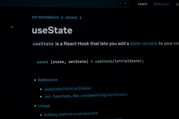 A screenshot of a programming reference or documentation page focused on the useState React Hook. The text explains that useState allows the addition of a state variable in a React component. It includes a code snippet demonstrating the syntax and provides reference and usage notes.