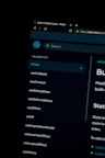 A dark-themed computer screen displaying the React Hooks documentation page. The left side lists various hooks like useCallback, useContext, and useEffect. The top shows the browser tab with the title 'Built-in React Hooks - React' and the URL highlighting a secure HTTPS connection.