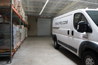a white van parked inside of a warehouse