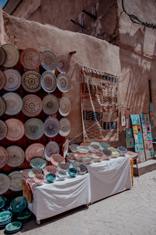A vibrant display of mittimaya’s stoneware pieces in a rustic market setting.