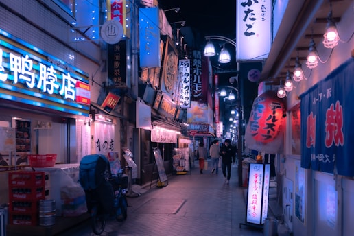 a city street filled with lots of neon signs