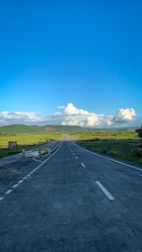 Travelers exchanging friendly waves and enjoying conversations at a bustling rest stop along a cross-country route.